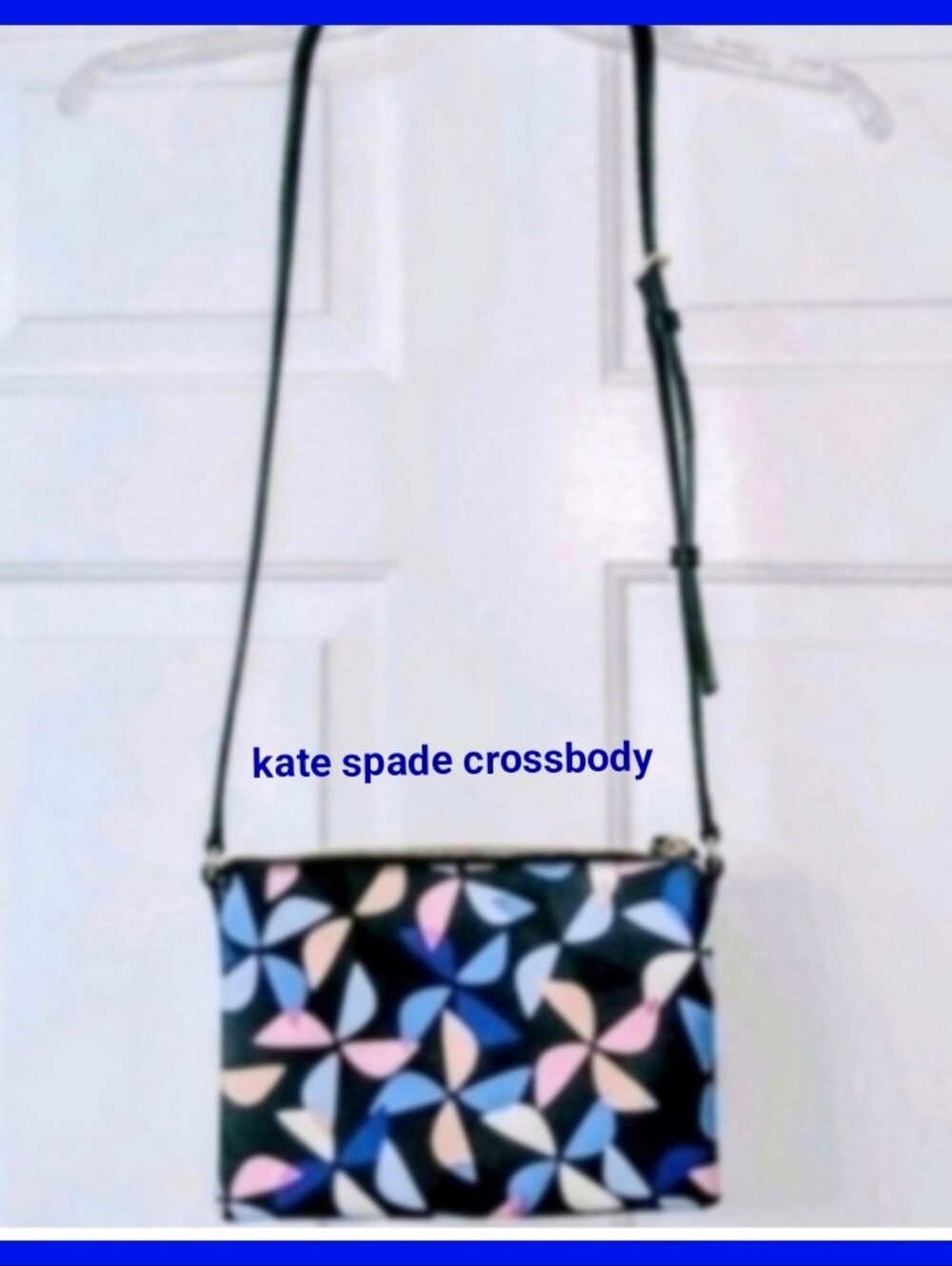 Kate Spade Hawthorne cross-body Carolyn spinner handbag. Navy with pink pinwheel